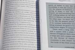 Kindle 3 E Ink vs Real Book Photo(Photo Courtesy of: http://www.e-reader-info.com/kindle-3-e-ink-vs-real-book-photo)